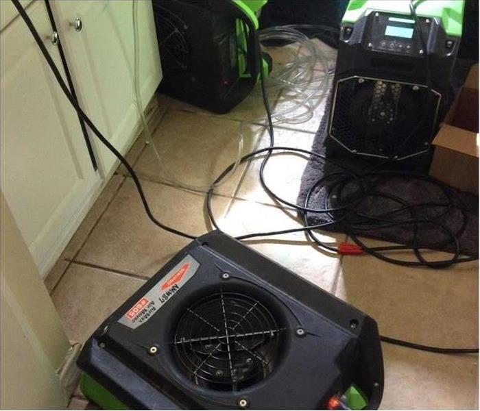 Air movers and dehumidifiers placed in a damaged area
